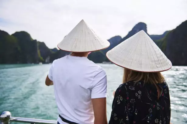 Rear view of couple in hats during the cruise